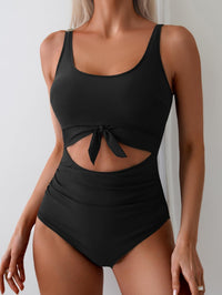 Badpak voor dames met buikcorrigerend effect, cut-out en strikknoop