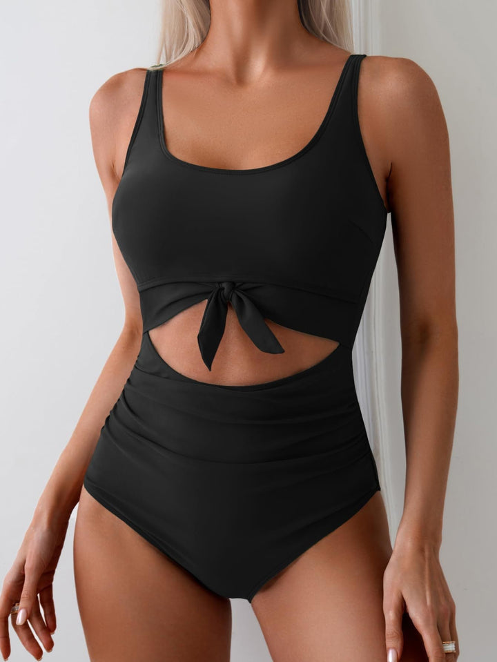 Badpak voor dames met buikcorrigerend effect, cut-out en strikknoop