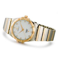 Tweekleurig horloge met Romeinse cijfers